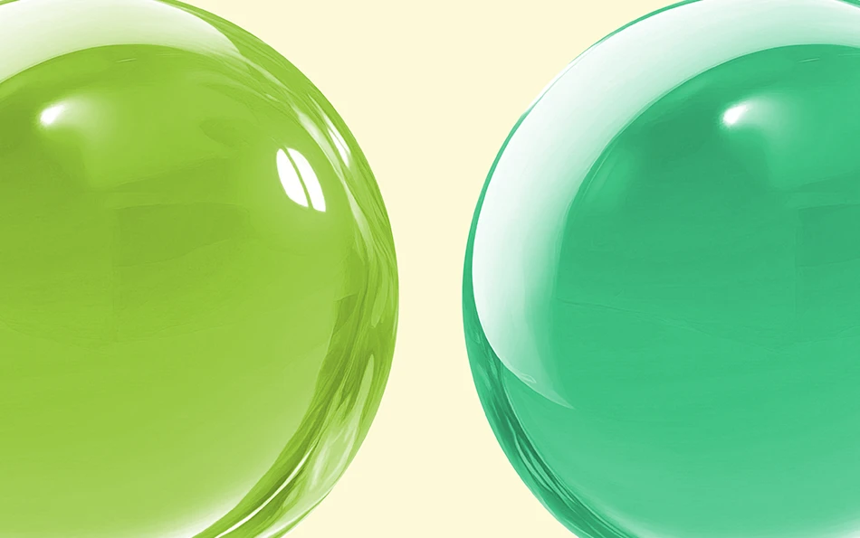 Eine hell und eine dunkel grüne Kugel